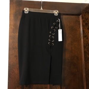 Black skirt with gold detail.